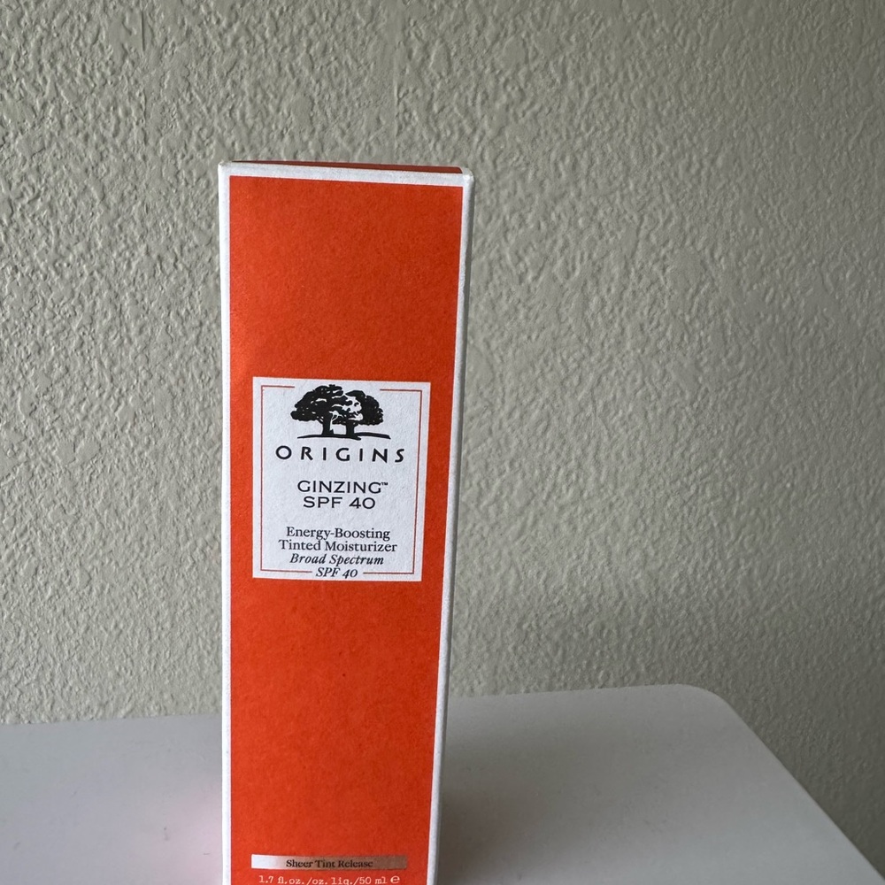 Origins Sunscreen with SPF 40 in White and Orange